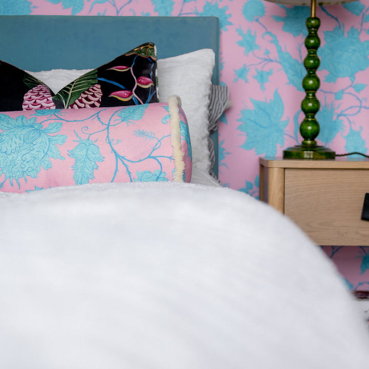 wear-the-walls-bolster-cushion-in-hermosa-pink-turquoise-vine-printed-velvet-fringed-edges-throw-cushion