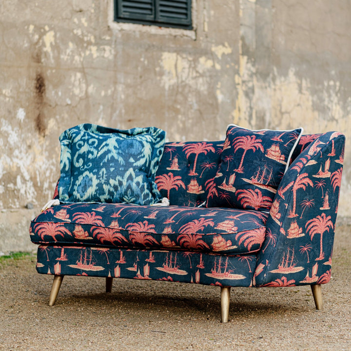 Mind-The-Gap-Venice-Tub-style-curved-sofa-couch-Aegean-linen-red-paln-print-navy-background-ships-trees-buttoned-back-exotic-print-metal-legs-hand-made