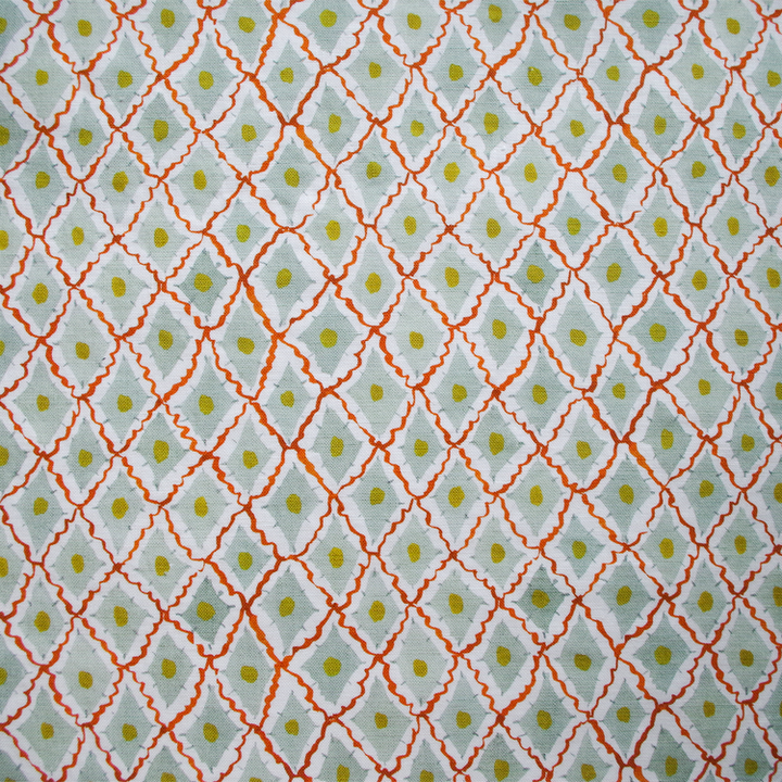 Lowri-textiles-diamond-harlequin-fabric-printed-blockprinted-green-red-yellow-fabric-cotton-linen-diamond-ditsy-pattern