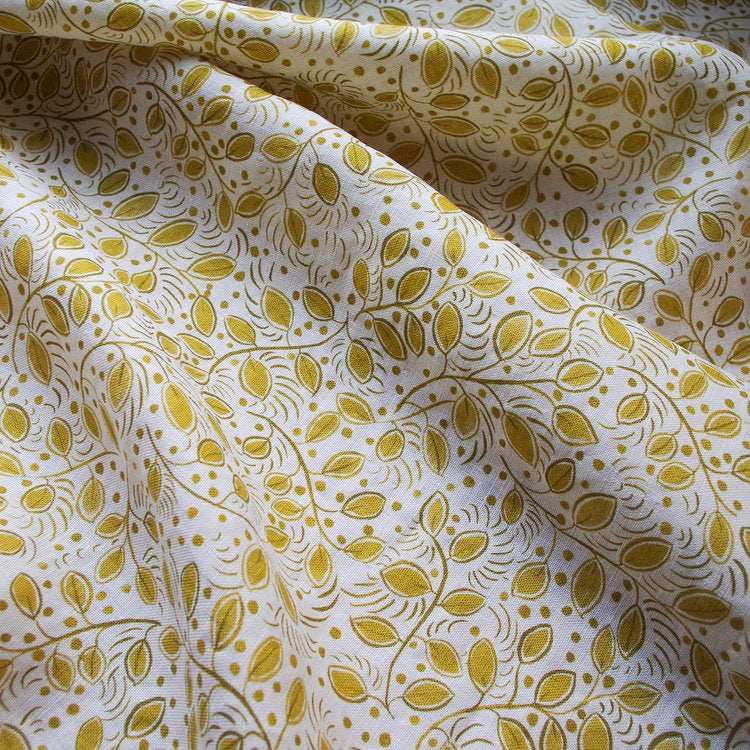 Lowri-textiles-linen-leaf-leaves-trailing-ditsy-print-little=leaves-yellow-upholstry-textile-fabric-blinds-curtains-floral-small-printed-white-yellow-